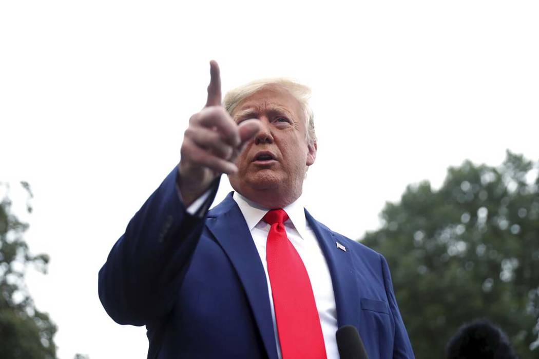 President Donald Trump speaks to members of the media on the South Lawn of the White House in W ...