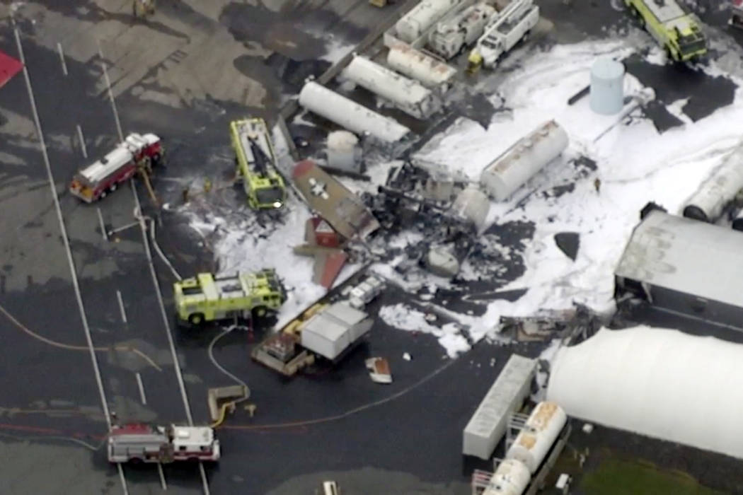 In this aerial image taken from video, emergency crews respond to where a World War II-era bomb ...