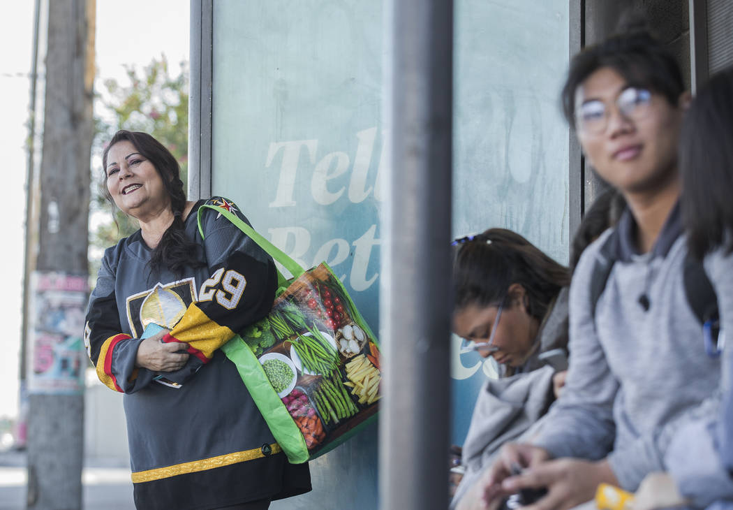 Elena Leger, left, waits for an RTC bus to take her to Toshiba Plaza to watch the Vegas Golden ...