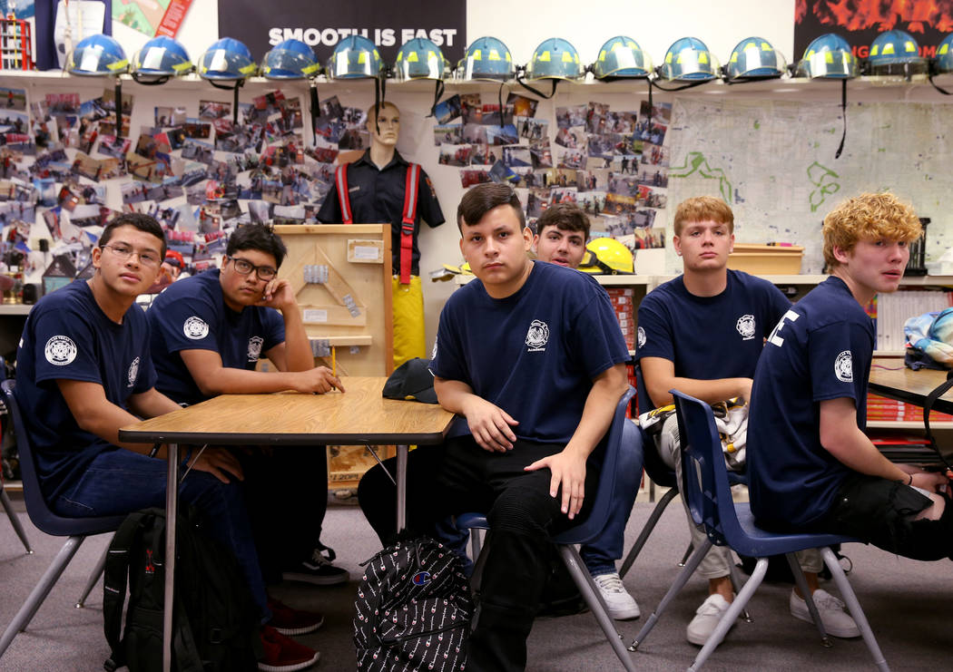 Bonanza High School Fire Science Academy students, from left, junior Christopher Ortega, senior ...