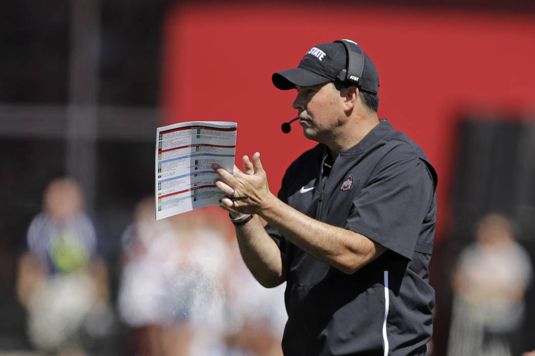 Ohio State head coach Ryan Day reacts after a touchdown during the first half of an NCAA colleg ...