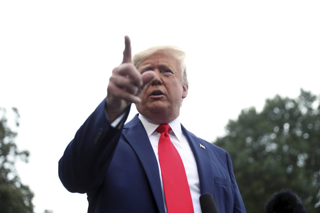 President Donald Trump speaks to members of the media on the South Lawn of the White House in W ...