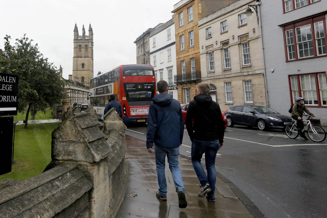 FILE - In this Sept. 3, 2017, file photo, people walk around Oxford University's campus in Oxfo ...