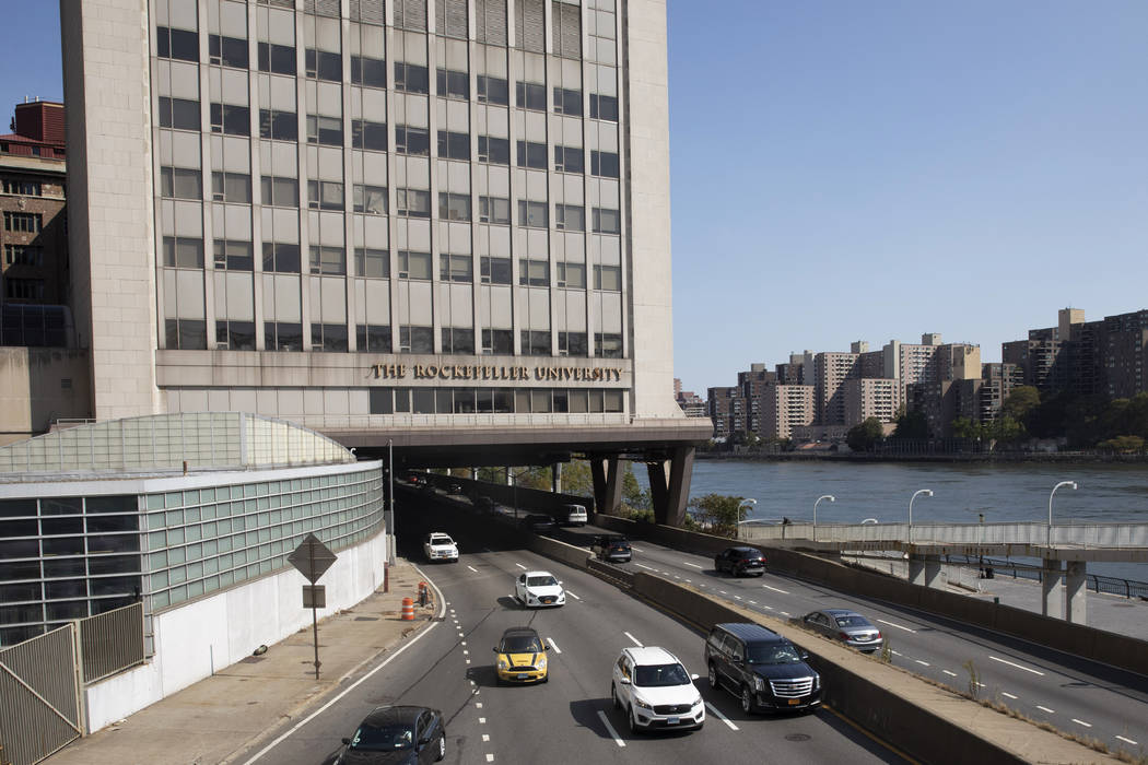 In a Sept. 26, 2019, photo, cars pass Rockefeller University in New York. Prestigious universit ...