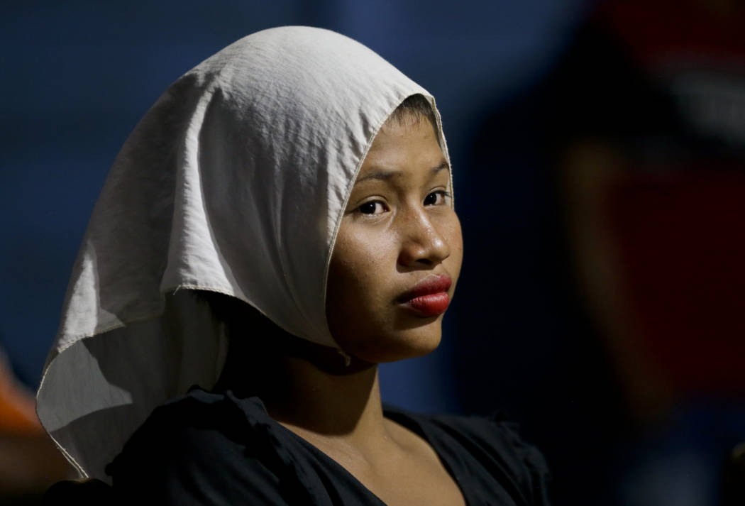 A young worshipper attends a prayer ceremony led in the Tikuna language by Antelmo Pereira, a v ...