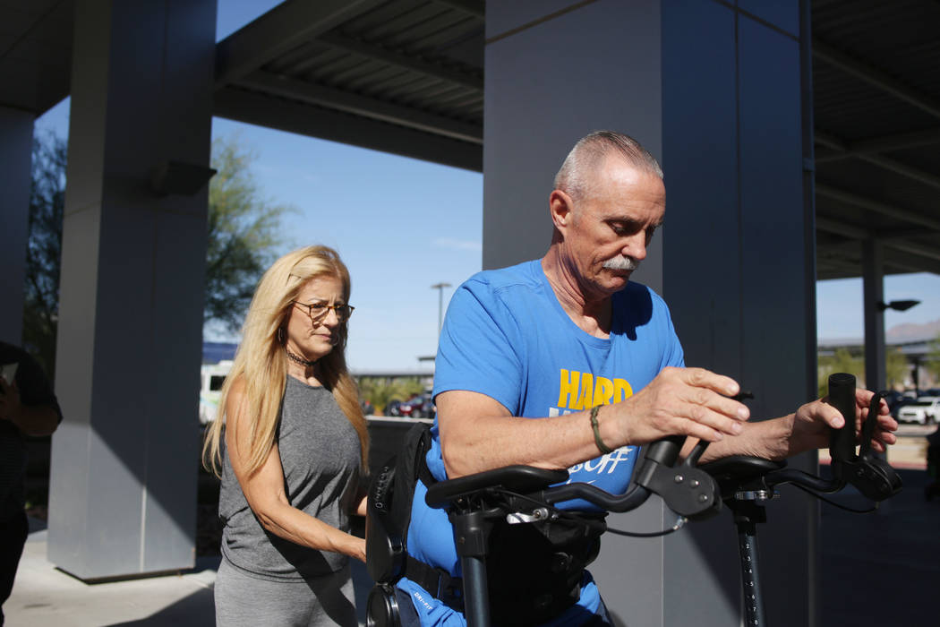 Lisa Christianson, left, helps her husband former Army Sgt.1st Class Green Beret Vietnam vetera ...