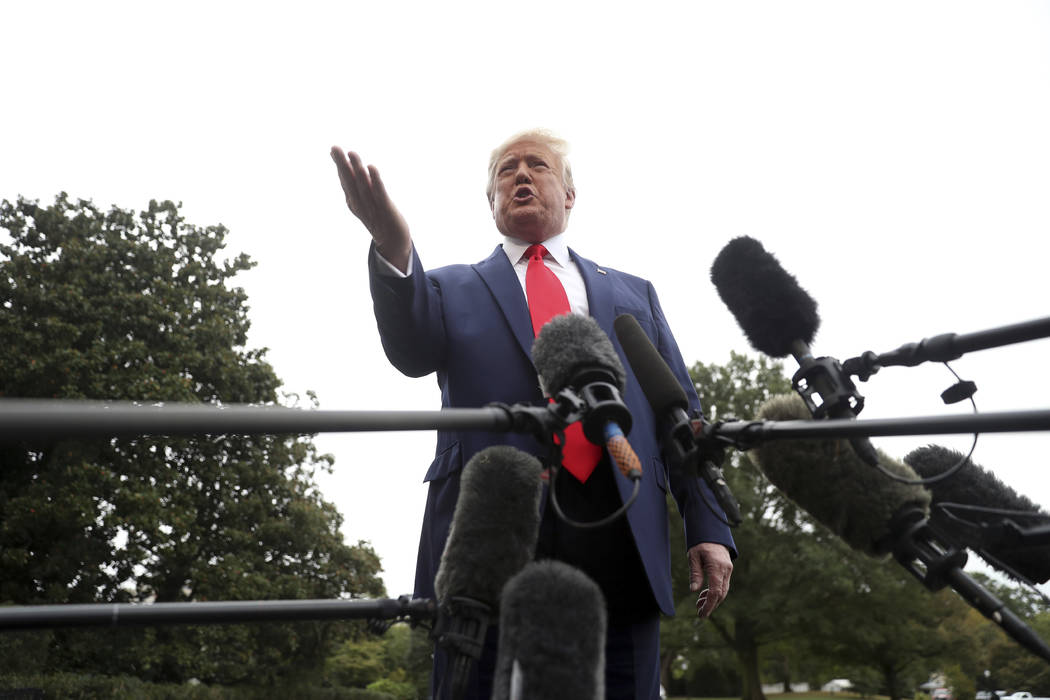 President Donald Trump speaks to members of the media on the South Lawn of the White House in W ...