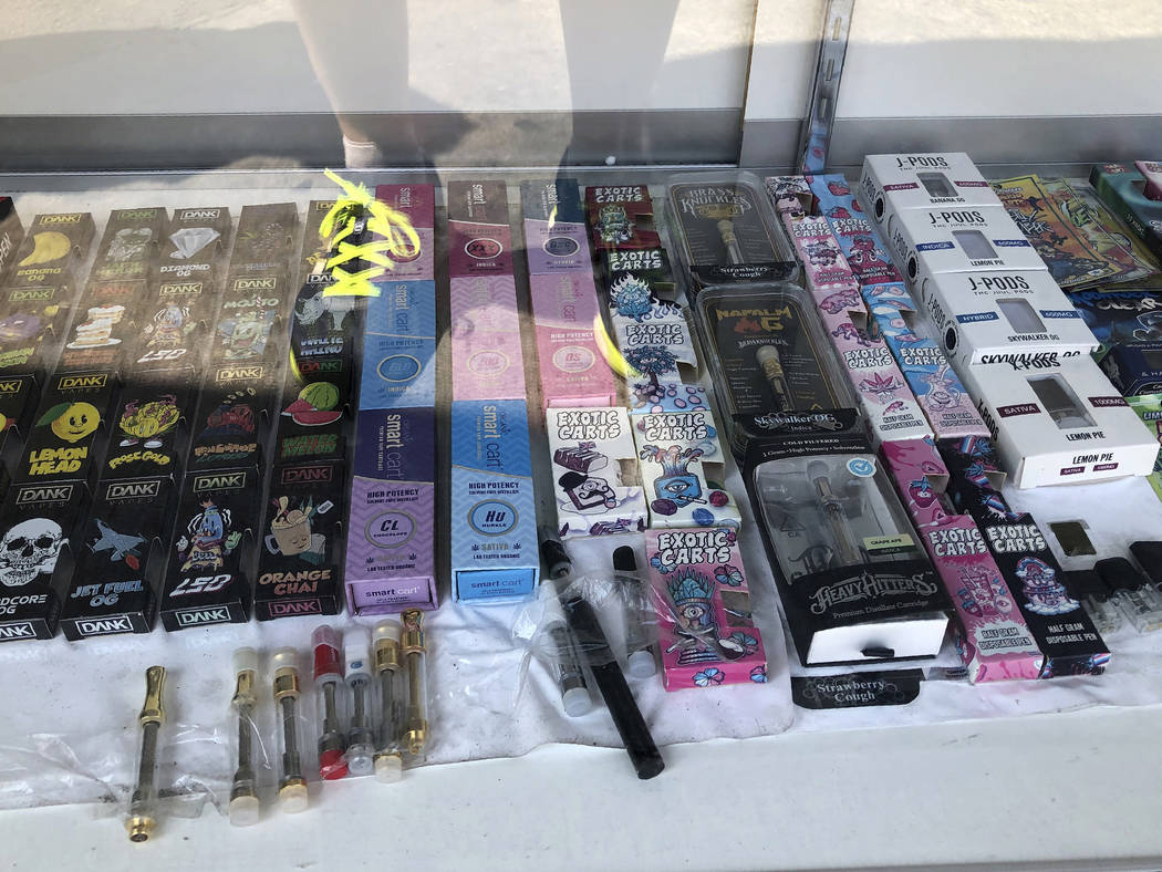 FILE - This Aug. 28 2019, file photo shows boxes of vaping products labeled with the Dank name, ...