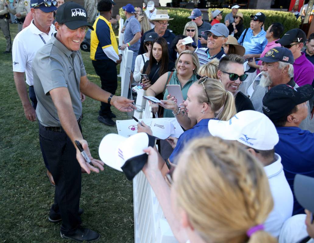 Phil Mickelson signs autographs after finishing up on the 18th hole during second round of Shri ...