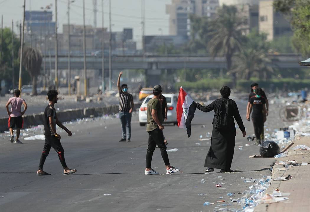 Anti-government protesters gather for a demonstration in Baghdad, Iraq, Friday, Oct. 4, 2019. I ...