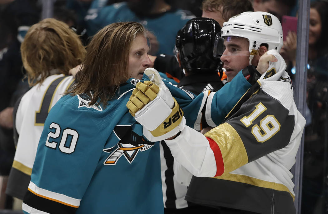 San Jose Sharks' Marcus Sorensen (20) tussles with Vegas Golden Knights' Reilly Smith (19) duri ...