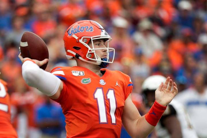 Florida quarterback Kyle Trask throws a pass against Towson during the first half of an NCAA co ...