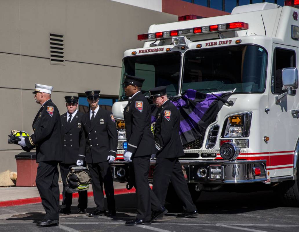 The gear of deceased Henderson Fire Department firefighter/paramedic Robbie James Pettingill is ...