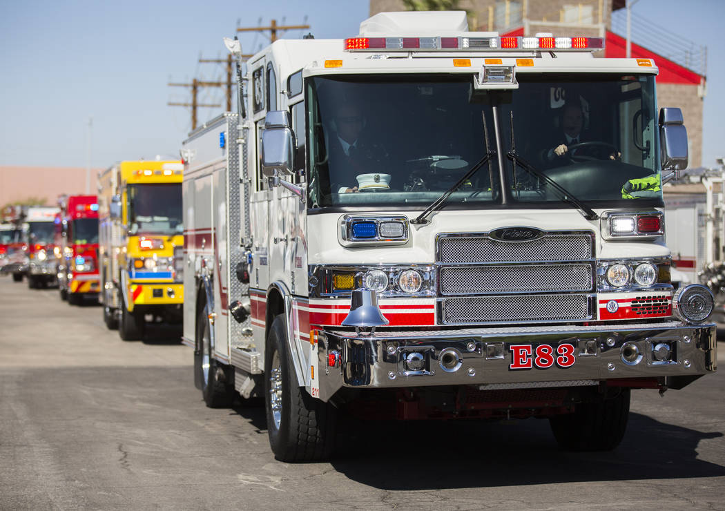 A motorcade of Henderson Fire and Police Department personnel escort the cremated remains of H ...