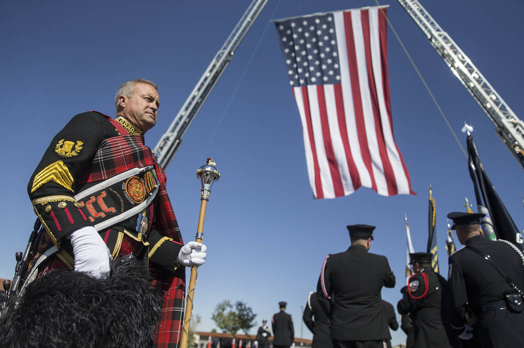 Henderson Fire and Police Department personnel march in a procession honoring Henderson Fire De ...