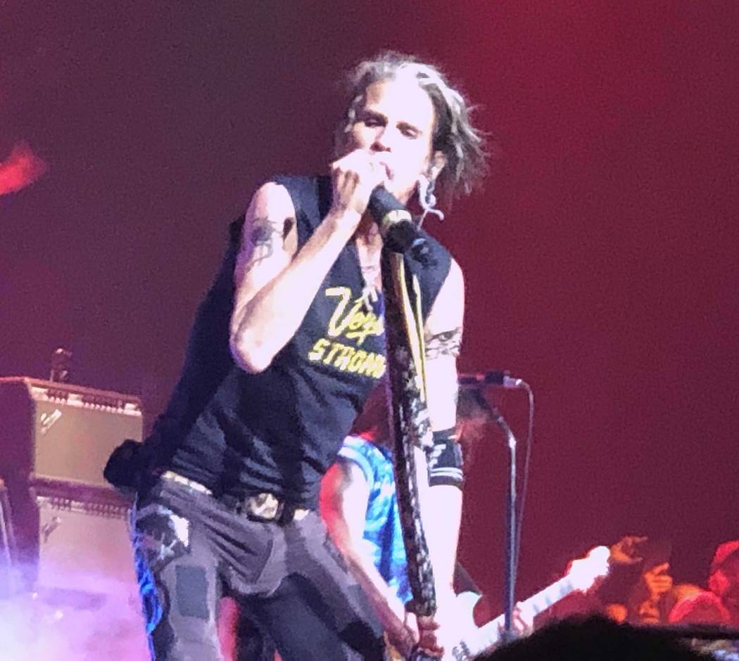 Steven Tyler performs "Come Together" in a T-shirt honoring Oct. 1 shooting victims at Aerosmit ...