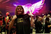 Barbie Dahl of Las Vegas shows off the Vegas Strong T-shirt tossed to the crowd after Aerosmith ...