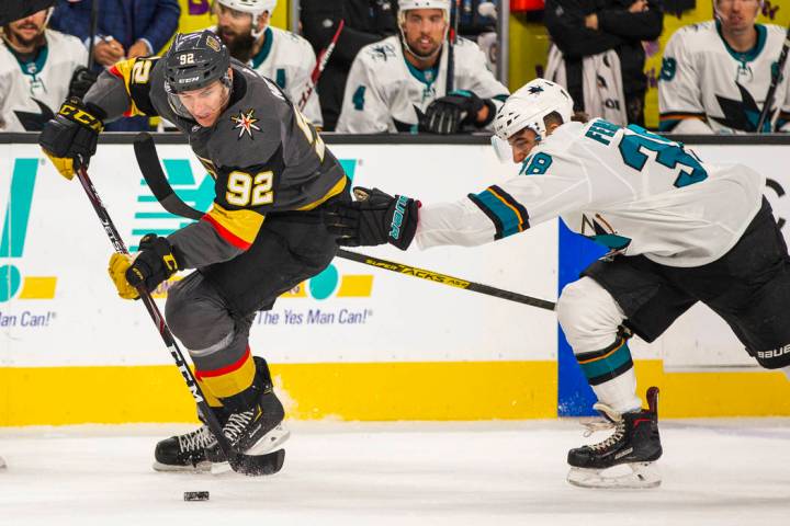 Vegas Golden Knights left wing Tomas Nosek (92) sets up a shot attempt over San Jose Sharks def ...