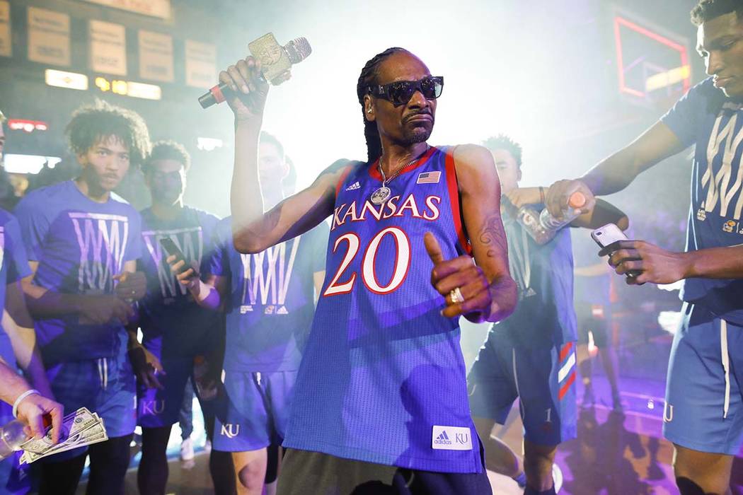 In this Friday, Oct. 4, 2019 photo, rapper Snoop Dogg performs for the Allen Fieldhouse crowd d ...