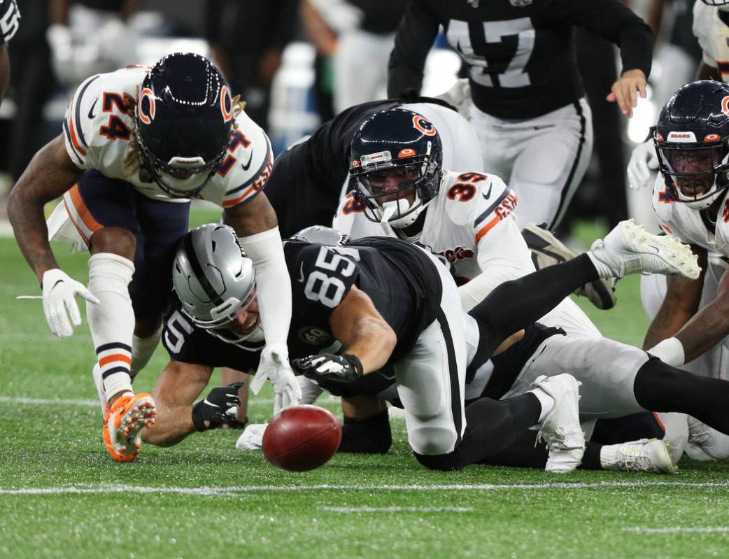 Oakland Raiders tight end Derek Carrier (85) tries to evade Chicago Bears free safety Eddie Jac ...