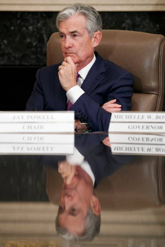 Federal Reserve Chairman Jerome Powell listens to feedback during a panel at the Federal Reserv ...