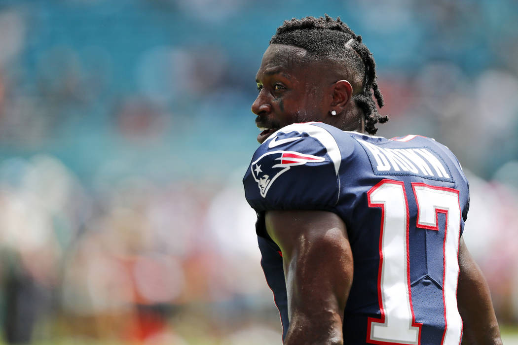 New England Patriots wide receiver Antonio Brown (17) stands on the sidelines during the first ...