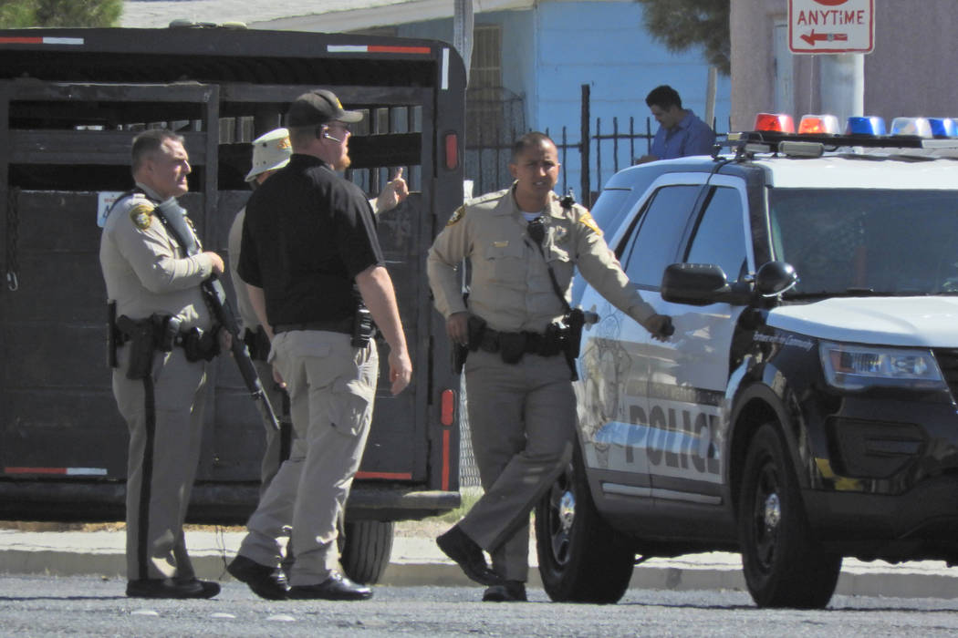 Police attempt to corral an escaped rodeo bull Sunday, Oct. 6, 2019, near Owens Avenue and Bett ...