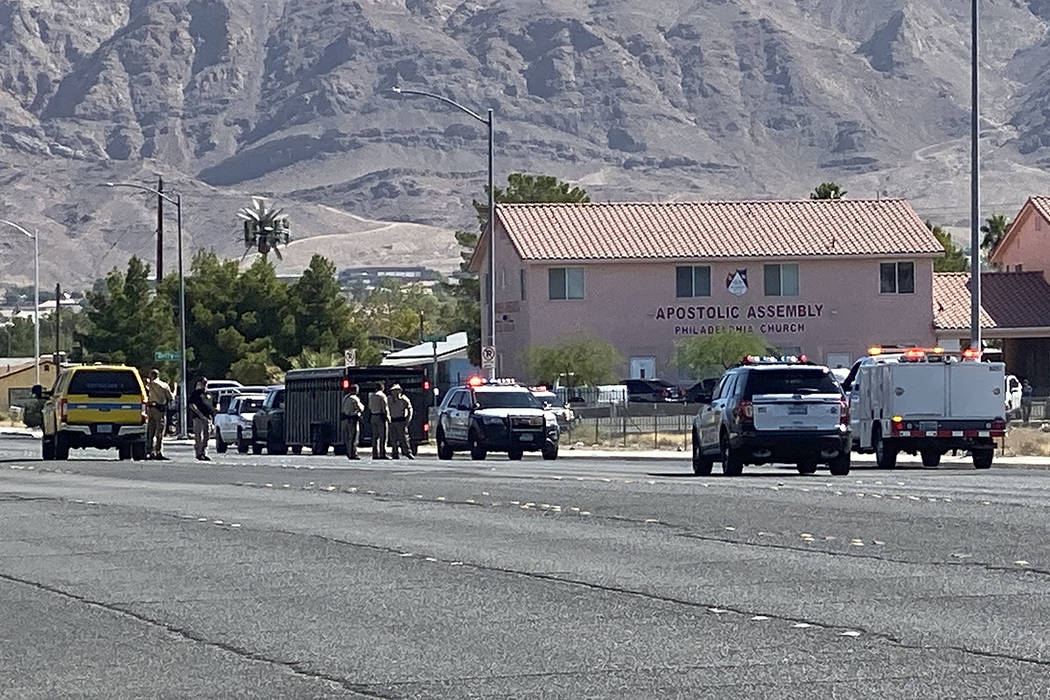 Police attempt to corral an escaped rodeo bull Sunday, Oct. 6, 2019, near Owens Avenue and Bett ...