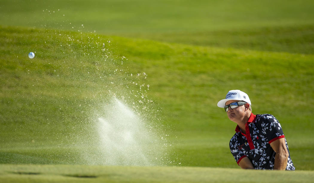 Brian Gay blasts from the sand onto the green at hole 9 during the final round of Shriners Hosp ...