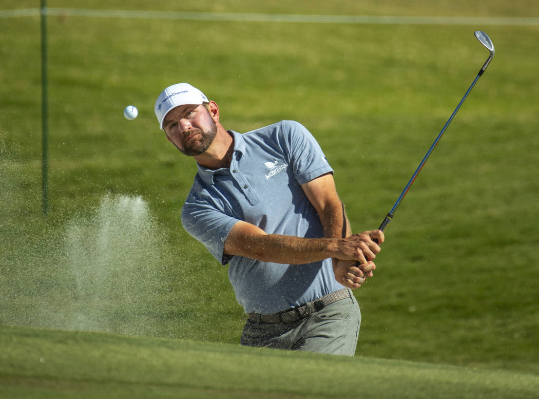 Lucas Glover hits out of the bunker onto the green at hole 9 during the final round of Shriners ...