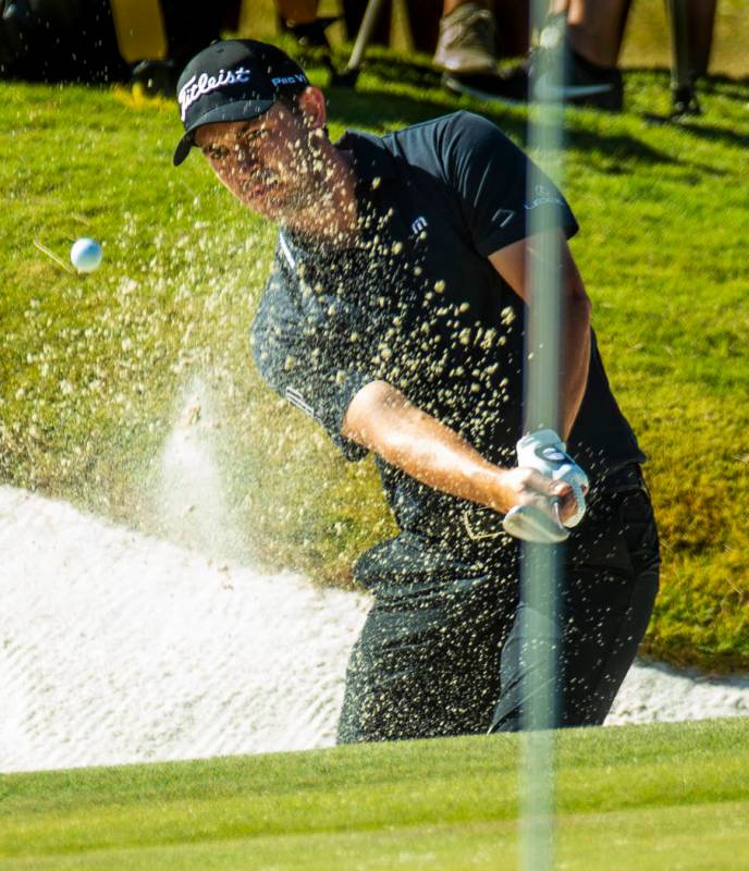 Patrick Cantlay blasts out of the sand onto the green at hole 9 during the final round of Shrin ...