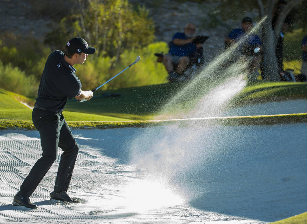 Patrick Cantlay blasts out of the sand onto the green at hole 15 during the final round of Shri ...