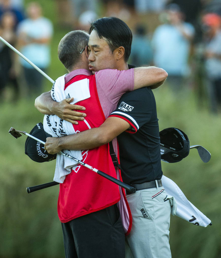 Kevin Na hugs his caddie as he celebrates his victory on the second playoff hole at 18 during t ...