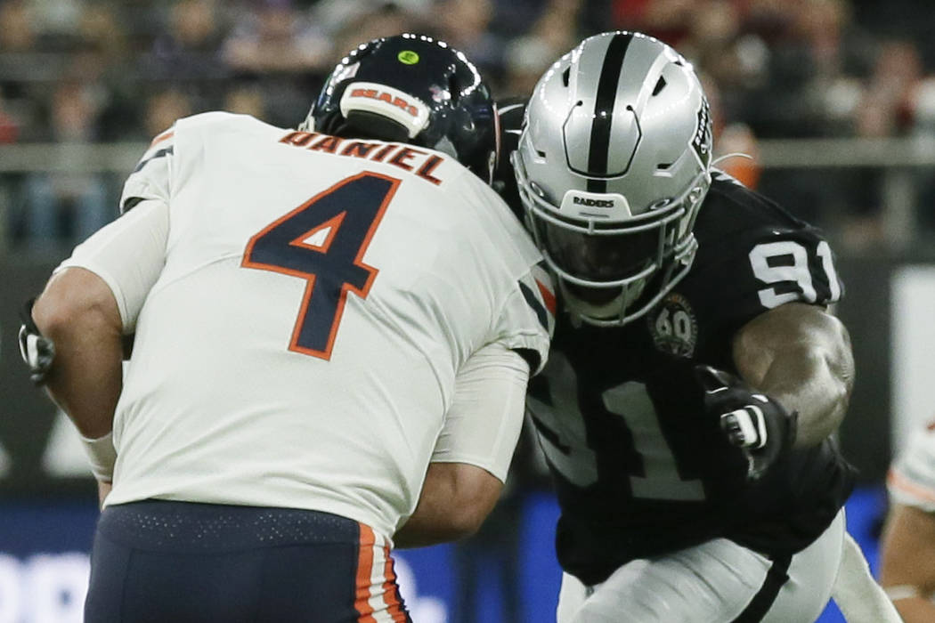 Chicago Bears quarterback Chase Daniel (4) is sacked by Oakland Raiders defensive end Benson Ma ...