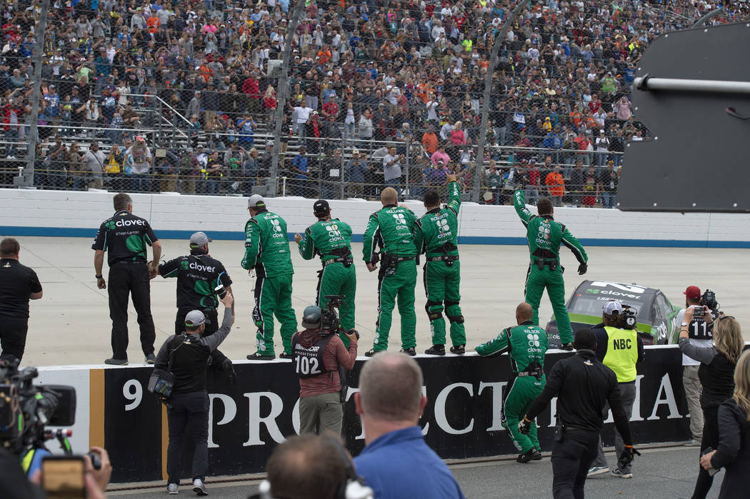Kyle Larson's team celebrates on pit road after his win in the NASCAR Cup Series playoff auto r ...