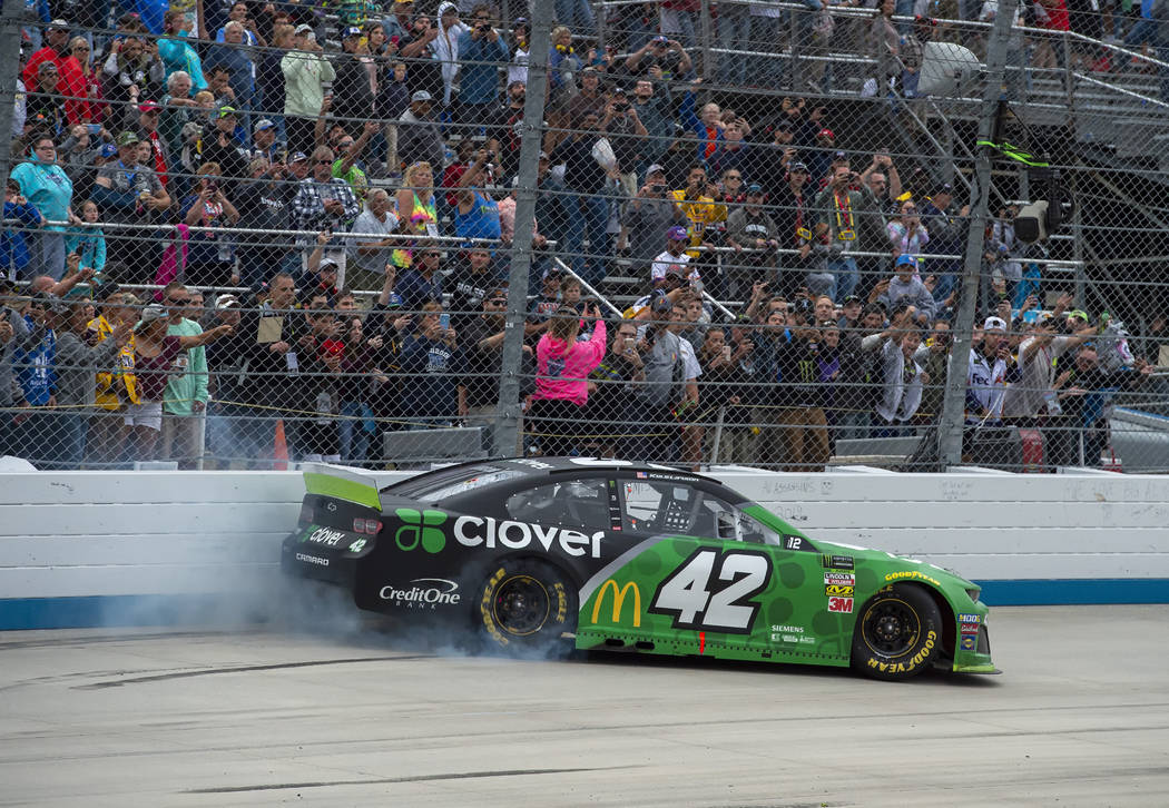 Kyle Larson does a burnout after winning the NASCAR Cup Series playoff auto race Sunday, Oct. 6 ...