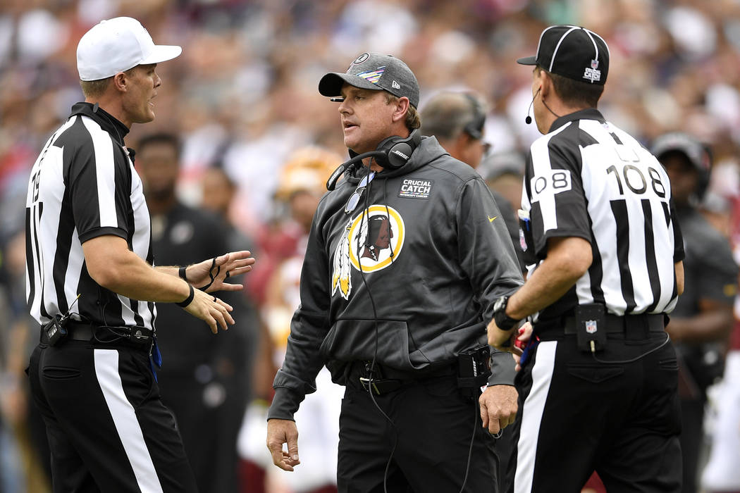 Washington Redskins head coach Jay Gruden speaks to officals during the first half of an NFL fo ...
