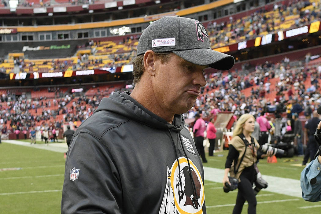 Washington Redskins head coach Jay Gruden leaves the field after an NFL football game against t ...