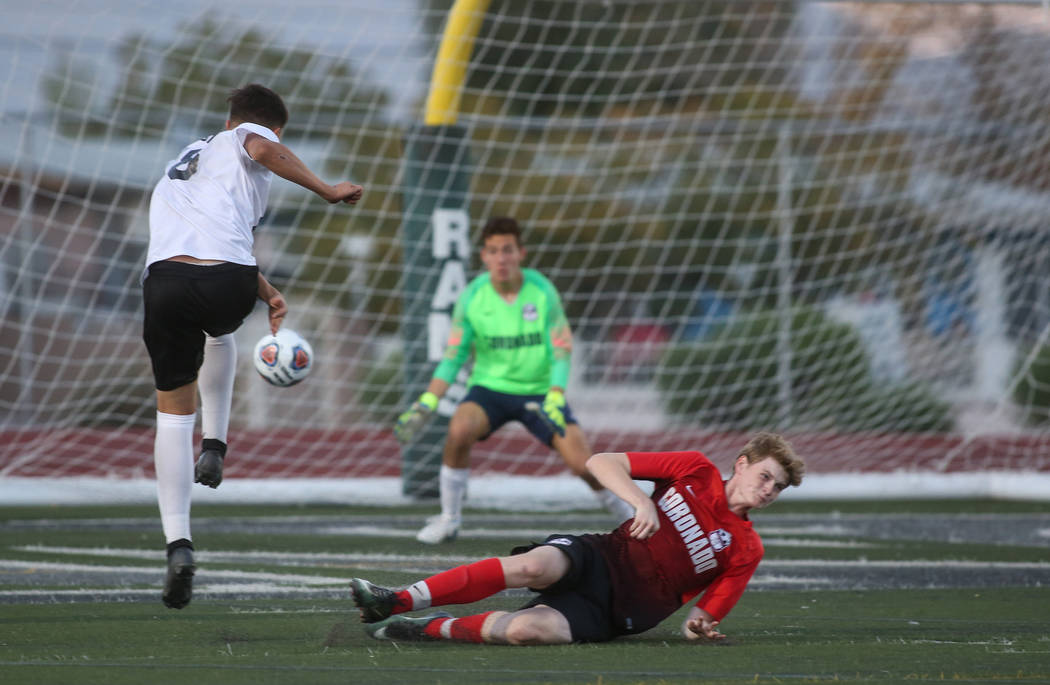 Las Vegas' Sergio Aguayo (18) takes a shot against Coronado's Josue Ruiz during the Southern Ne ...