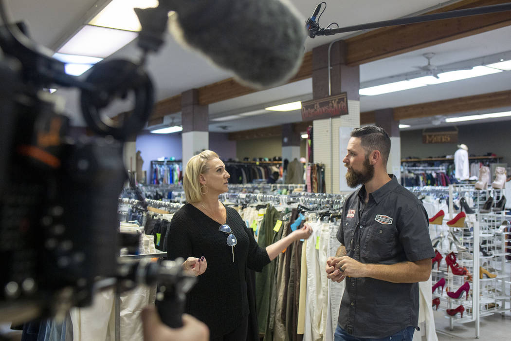 A camera team records Heather Engle, CEO of Las Vegas Rescue Mission, left, and pastor Brandan ...