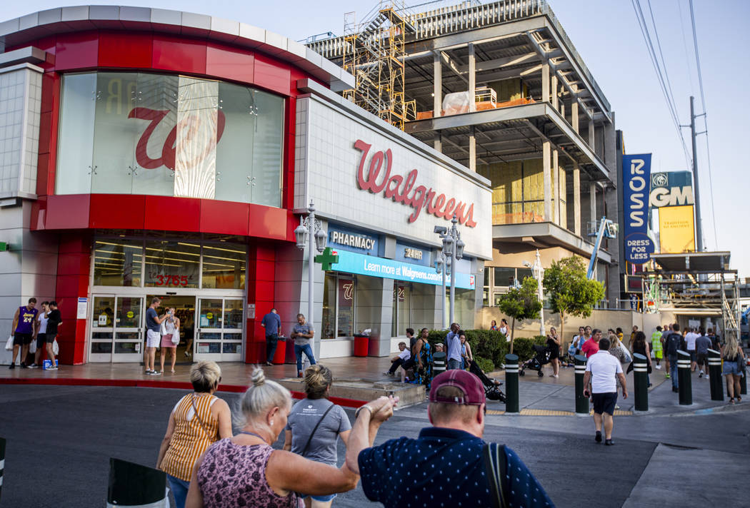 People walk by the Walgreens on the Las Vegas Strip on Tuesday, Sept. 10, 2019, in Las Vegas. ( ...