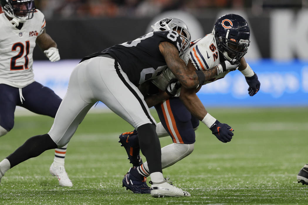 Chicago Bears outside linebacker Khalil Mack (52) is blocked by Oakland Raiders tight end Foste ...