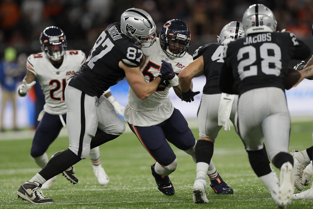 Chicago Bears outside linebacker Khalil Mack (52) is blocked by Oakland Raiders tight end Foste ...