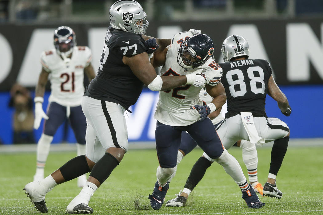Chicago Bears outside linebacker Khalil Mack (52) is blocked by Oakland Raiders offensive tackl ...
