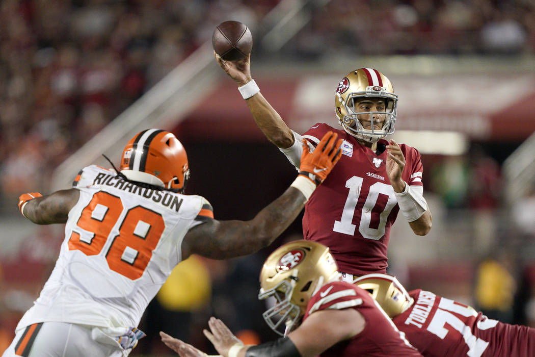 San Francisco 49ers quarterback Jimmy Garoppolo (10) passes as Cleveland Browns defensive tackl ...
