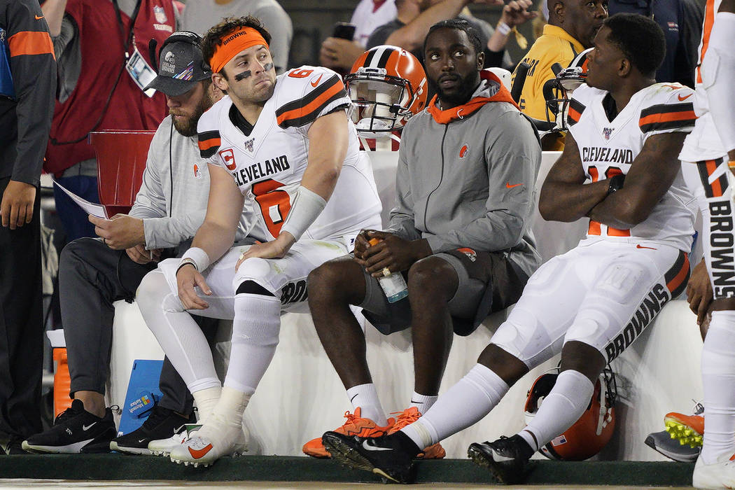 Cleveland Browns quarterback Baker Mayfield (6) sits on the bench with teammates during the sec ...