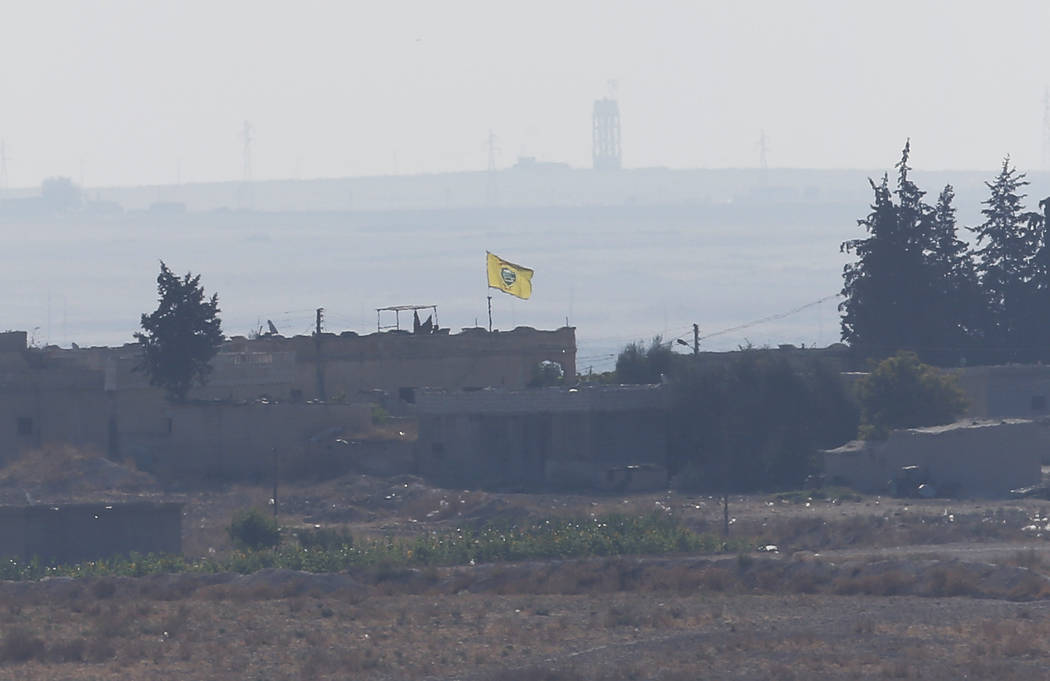 In this photo taken from the Turkish side of the border between Turkey and Syria, in Akcakale, ...