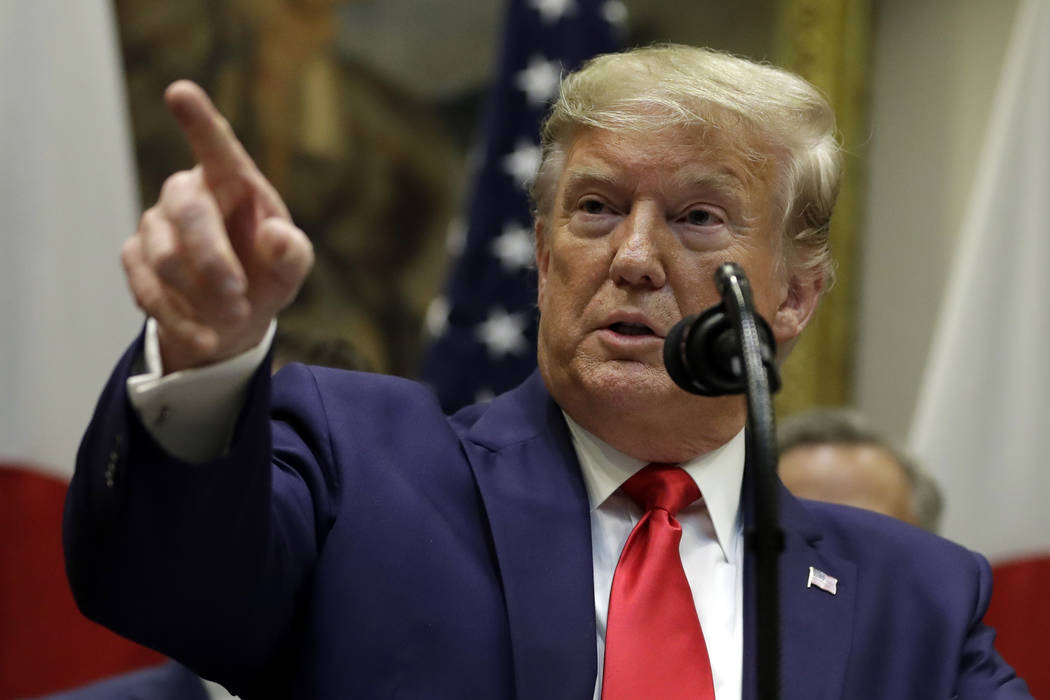 President Donald Trump speaks after a signing ceremony for a trade agreement with Japan in the ...