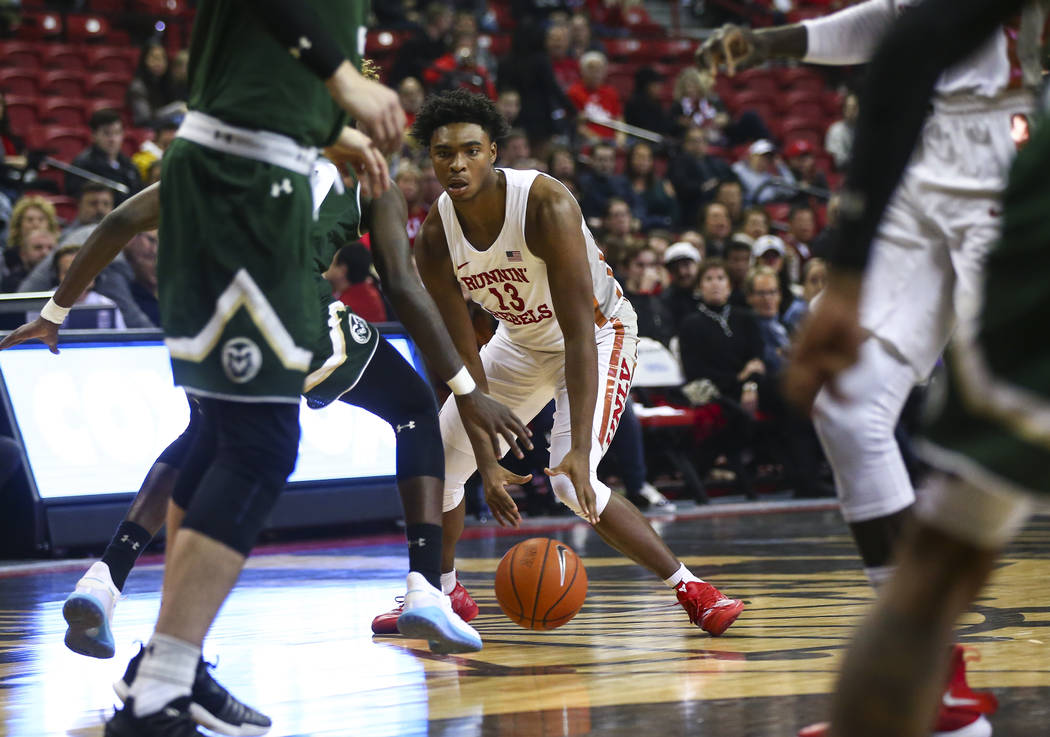 UNLV Rebels guard Bryce Hamilton (13) brings the ball up court against Colorado State during th ...
