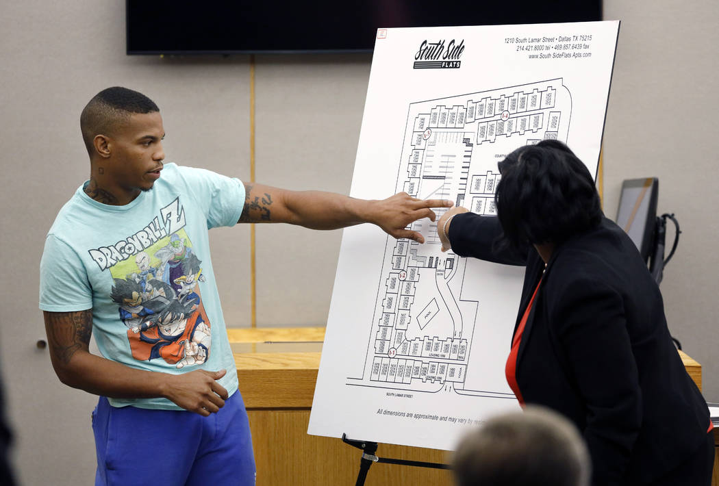 In a Sept. 24, 2019, photo, victim Botham Jean's neighbor Joshua Brown, left, answers questions ...